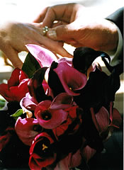 putting wedding ring on finger.