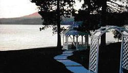 Wedding arch and gazebo at dusk.