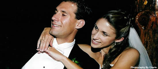 Bride and groom smiling at their resort wedding.